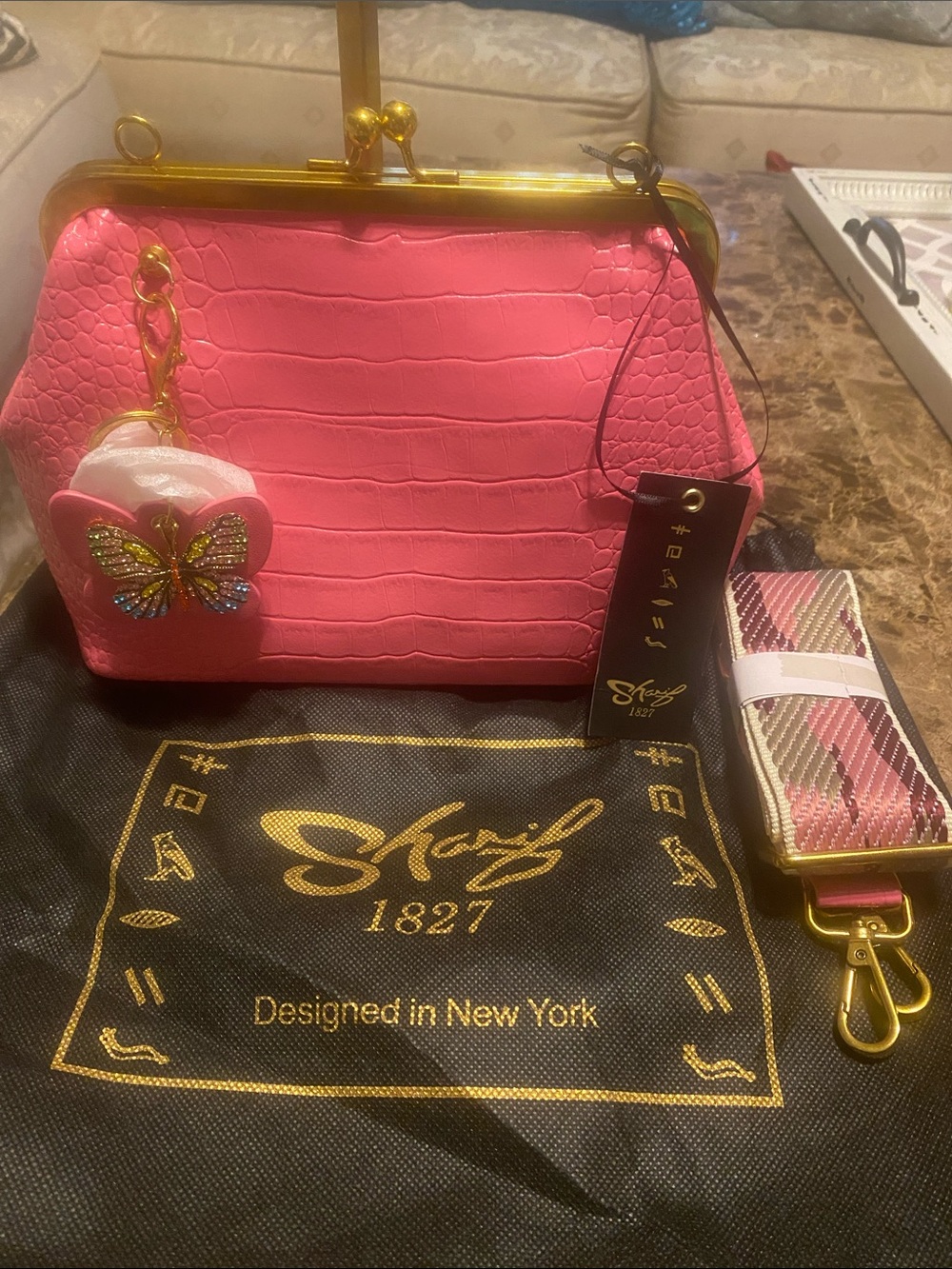 Sharif Pink Croc-Embossed Frame Bag with Butterfly Charm. Dust bag included.
